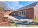 Backyard brick patio with sliding glass doors leading to the house at 1963 Wexford Ct, Gastonia, NC 28054