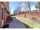 Private backyard featuring a brick wall and walkway at 1963 Wexford Ct, Gastonia, NC 28054