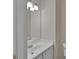Bathroom featuring a white vanity, sink, and ample mirror illuminated by modern lighting at 1963 Wexford Ct, Gastonia, NC 28054