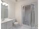 Bathroom featuring a vanity, toilet, and glass-enclosed shower with white tile at 1963 Wexford Ct, Gastonia, NC 28054