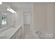 Spacious bathroom featuring double sinks, a bathtub, and ample counter space at 1963 Wexford Ct, Gastonia, NC 28054