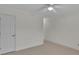 Bedroom with neutral carpet, ceiling fan, and white door at 1963 Wexford Ct, Gastonia, NC 28054