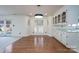 Bright dining room with hardwood floors, modern lighting, and natural light at 1963 Wexford Ct, Gastonia, NC 28054