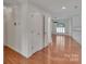 Bright entryway featuring hardwood floors, white trim, and multiple doorways at 1963 Wexford Ct, Gastonia, NC 28054