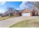 Attractive brick home featuring a two-car garage and landscaped front yard at 1963 Wexford Ct, Gastonia, NC 28054