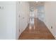 Bright hallway featuring wood floors and white trim at 1963 Wexford Ct, Gastonia, NC 28054