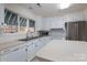 Well-lit kitchen featuring stainless steel appliances, white cabinets, and a functional island at 1963 Wexford Ct, Gastonia, NC 28054