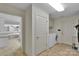 Bright laundry room features white cabinets and updated washer and dryer set for a clean space at 1963 Wexford Ct, Gastonia, NC 28054