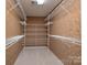 Spacious walk-in closet with ample shelving for optimal organization and storage at 1963 Wexford Ct, Gastonia, NC 28054