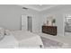 Main bedroom with tray ceilings and view into bathroom at 19728-A School St, Cornelius, NC 28031