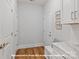 Hallway with white cabinets, bench, and wood floors, creating a functional and stylish entryway at 19728-A School St, Cornelius, NC 28031