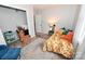 Bedroom with natural lighting, rug, and bright colored pillows on bedspread with floral pattern at 2010 Simmons St, Gaston, NC 28052