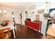 Open dining area with hardwood floors flowing into a kitchen, with ample storage and natural light at 2010 Simmons St, Gaston, NC 28052