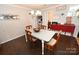 Inviting dining space with hardwood floors, a simple table, and comfortable seating at 2010 Simmons St, Gaston, NC 28052