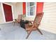 Cozy front porch featuring two chairs and a small table, perfect for relaxing outdoors at 2010 Simmons St, Gaston, NC 28052