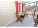 Covered front porch featuring outdoor seating with stylish accent furniture and ample natural light at 2010 Simmons St, Gaston, NC 28052