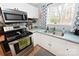 Modern kitchen featuring stainless steel oven and sink with a sunlit window at 2010 Simmons St, Gaston, NC 28052