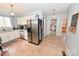 Functional kitchen featuring white cabinetry, stainless steel appliances, and tile flooring at 2010 Simmons St, Gaston, NC 28052