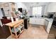 Bright kitchen with white cabinets, stainless steel appliances, and functional countertop space at 2010 Simmons St, Gaston, NC 28052