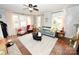 Bright living room with large windows, neutral tones, ceiling fan and a cozy atmosphere at 2010 Simmons St, Gaston, NC 28052