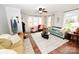 Comfortable living room with large windows, neutral tones, ceiling fan and a cozy atmosphere at 2010 Simmons St, Gaston, NC 28052