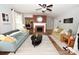 Open concept living room with a brick fireplace, modern seating, and natural light at 2010 Simmons St, Gaston, NC 28052