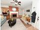 Inviting living room with brick fireplace, neutral rug, and ceiling fan at 2010 Simmons St, Gaston, NC 28052