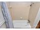 This bathroom features a shower/tub and beige tiling at 213 Turner Rd, Gastonia, NC 28056