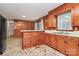 Functional kitchen with plentiful cabinetry, a serving counter, and durable flooring at 213 Turner Rd, Gastonia, NC 28056