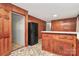 Bright kitchen featuring abundant wooden cabinets, countertop, and durable flooring at 213 Turner Rd, Gastonia, NC 28056