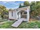 Modern shed with a ramp, a door, and exposed framing under an extended roof at 213 Turner Rd, Gastonia, NC 28056