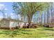 View of home exterior from backyard with deck, green lawn, and storage shed at 230 Valley View Dr, Clover, SC 29710