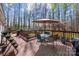 Spacious outdoor deck features outdoor furniture, including a table, chairs and umbrella for shade at 230 Valley View Dr, Clover, SC 29710