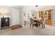 A carpeted dining area features a wooden table, upholstered chairs, and a built-in hutch for storage at 230 Valley View Dr, Clover, SC 29710