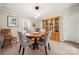 Cozy dining room featuring a round table, comfortable seating, and a wooden display cabinet at 230 Valley View Dr, Clover, SC 29710