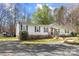 Inviting single-story home with gray siding, brick foundation, well-maintained lawn, and mature trees at 230 Valley View Dr, Clover, SC 29710