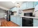 Kitchen featuring ample counter space, black appliances, and light-blue cabinetry at 230 Valley View Dr, Clover, SC 29710