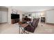 Spacious living room featuring a leather sofa, desk, and ample natural light from multiple windows at 230 Valley View Dr, Clover, SC 29710