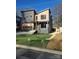 Modern two-story home featuring a unique facade, gray garage door, and a well-manicured front lawn at 2421 Barry St, Charlotte, NC 28205