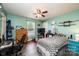 Comfortable bedroom with wood-look floors, a ceiling fan and colorful wall decor at 2561 Ellys St, Lincolnton, NC 28092