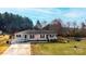 Charming house with a ramp, American flag, and well-manicured lawn, offering a welcoming curb appeal at 2561 Ellys St, Lincolnton, NC 28092