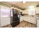 Classic kitchen features white appliances, bright lighting, and tile floors at 2561 Ellys St, Lincolnton, NC 28092