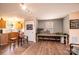 Living area showcasing kitchen access, hardwood floors and bright natural light at 2561 Ellys St, Lincolnton, NC 28092