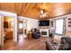 Cozy living room with wood-paneled ceiling, fireplace, and comfortable seating at 2561 Ellys St, Lincolnton, NC 28092