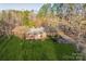 An overhead view of the home nestled amongst lush greenery and trees, set back from the lawn at 2750 Morgan Rd, Gold Hill, NC 28071