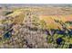 Aerial view of a wooded area with a house visible amongst the trees at 2750 Morgan Rd, Gold Hill, NC 28071