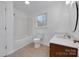 Bathroom featuring a vanity with solid surface countertop and tub and shower combo at 2750 Morgan Rd, Gold Hill, NC 28071