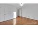 Bedroom featuring wood floors, dual closets and access to hallway at 2750 Morgan Rd, Gold Hill, NC 28071