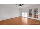 Bedroom with hardwood floors, ceiling fan and glass panel doors at 2750 Morgan Rd, Gold Hill, NC 28071