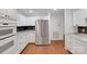 Modern kitchen featuring stainless steel appliances, white cabinetry, and a stylish backsplash at 2750 Morgan Rd, Gold Hill, NC 28071